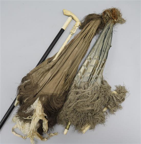 Two ivory handled parasols and a cane (a.f.)